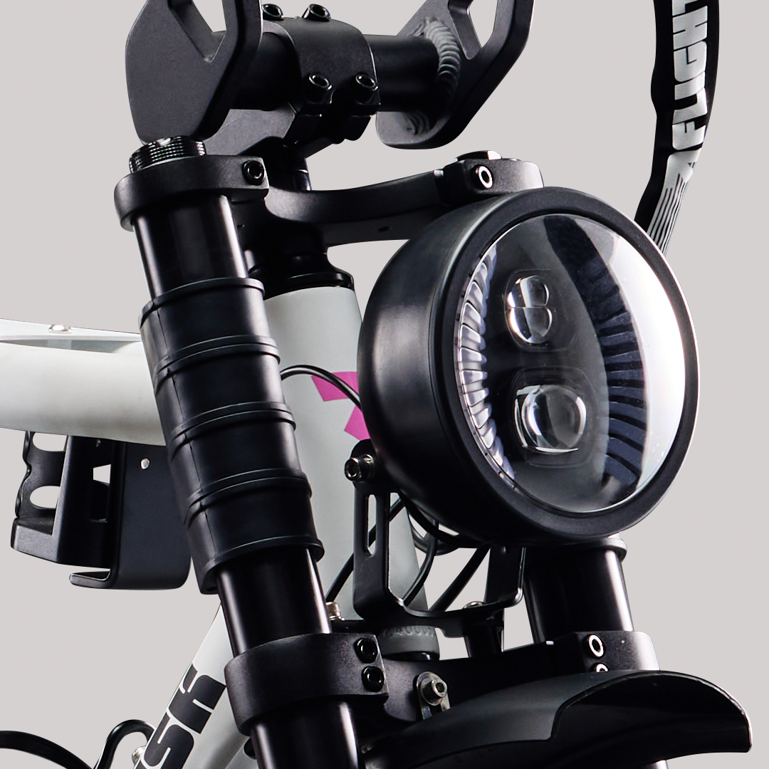 White FR555 e-bike from Flight Risk Australia with headlights and GPS